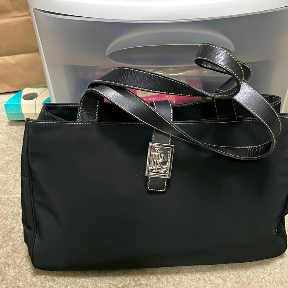 RLL on this lightly used bag, black material and black leather shoulder straps.